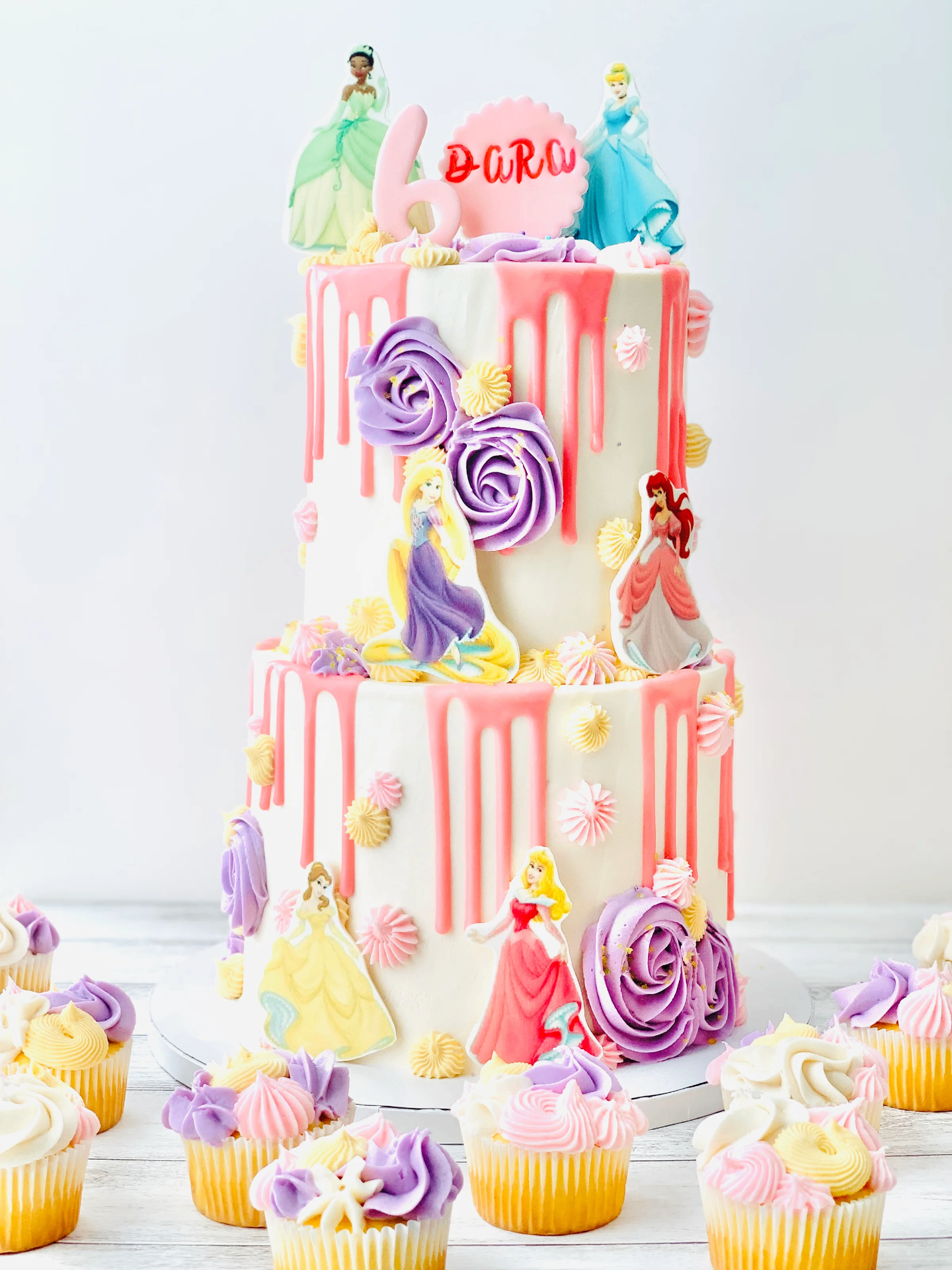Two tier princess birthday cake with pink drip